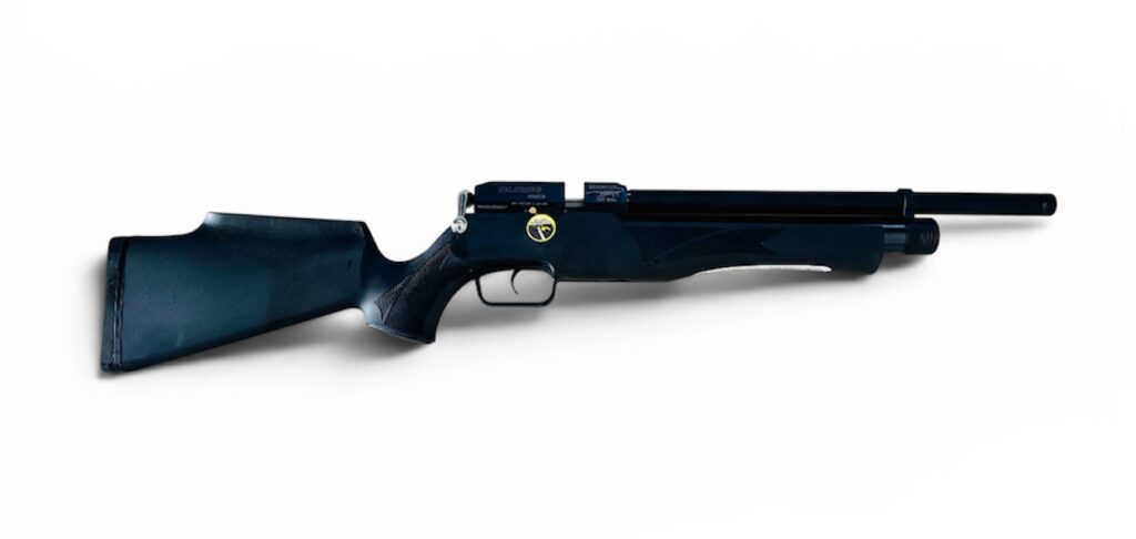 Blue-black bolt-action rifle lying horizontally on a white background, stock on the left and barrel pointing right.