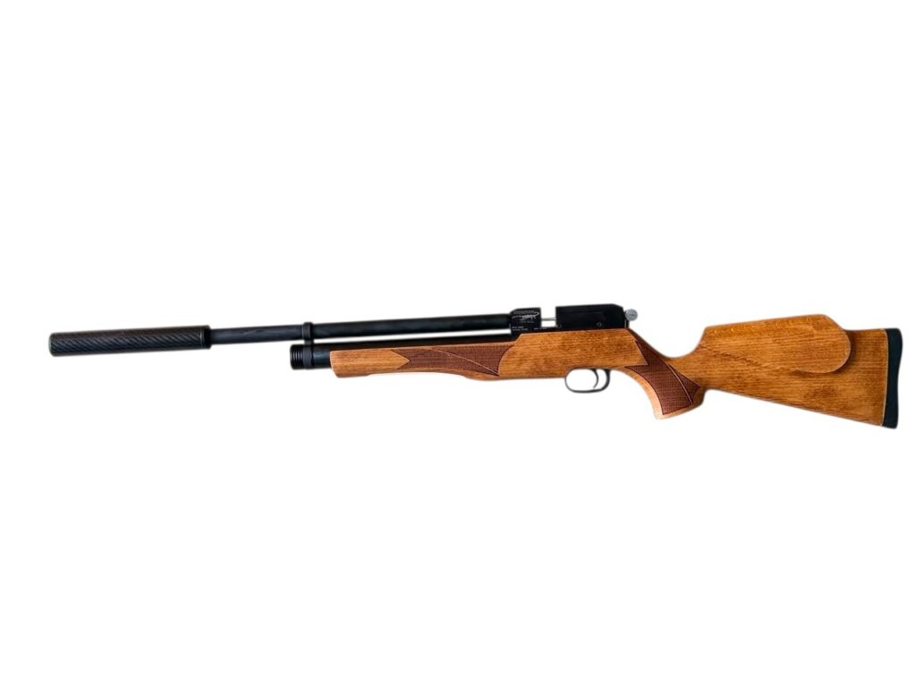 Bolt-action rifle with a wooden stock and a long barrel fitted with a suppressor attachment.