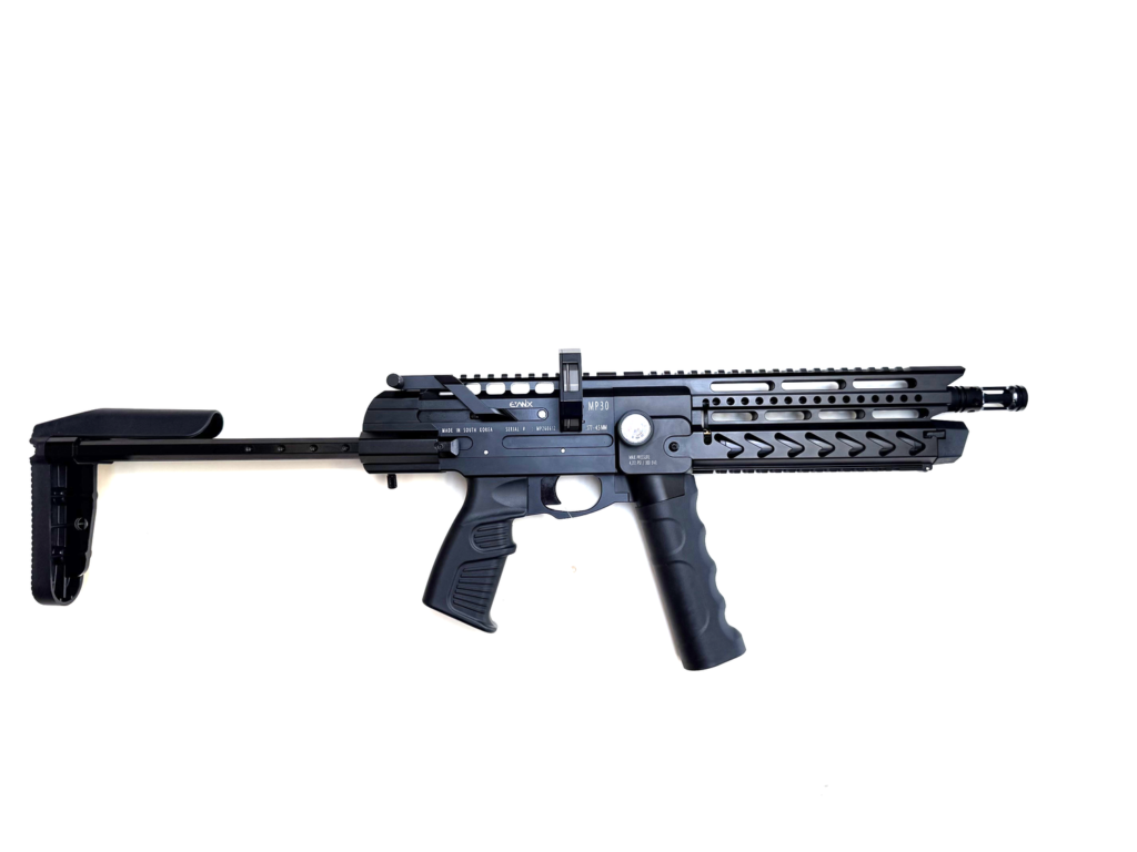 Side view of a black tactical rifle with adjustable stock and long handguard on a white background.