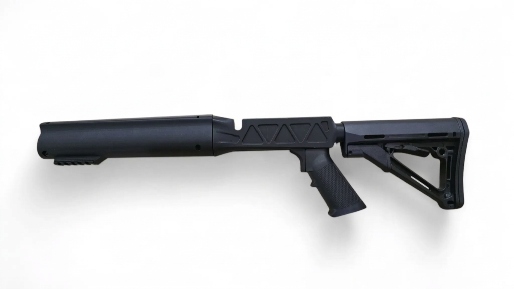 Side view of a black modular rifle stock with pistol grip on a white background (collapsible buttstock shown).